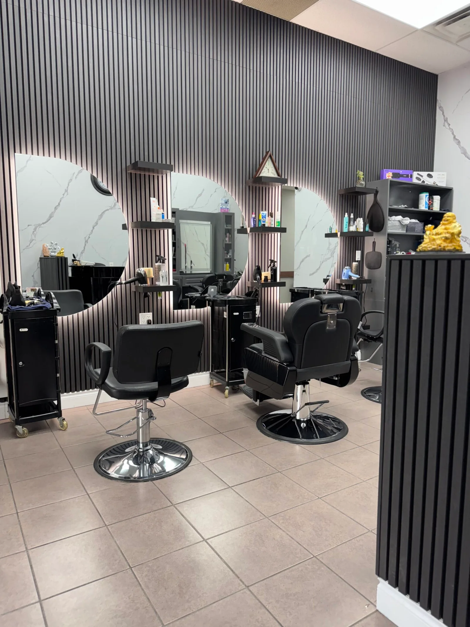 A row of styling chairs and mirrors inside 7 Heaven Salon & Spa